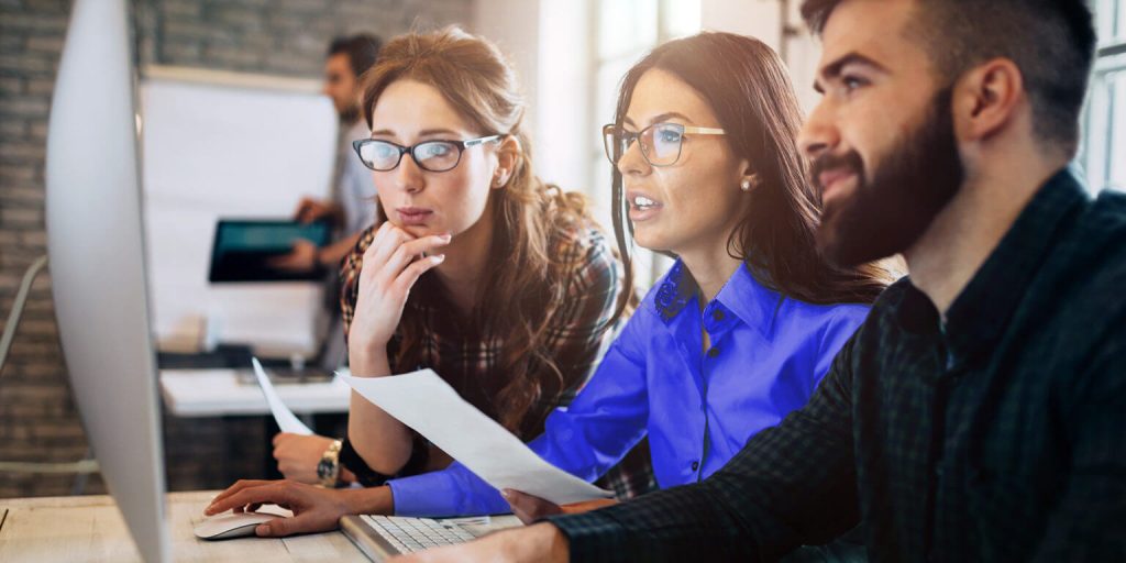 three people using a performance support sytem 1536x768 1